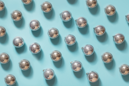 Christmas silver ball on blue background. Pattern.の写真素材