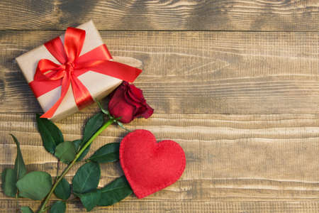 Valentine's day background with love gift, red roses and heart shapes. View from above. Copy space. Flat lay. Mother day.の写真素材