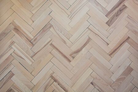Parquet texture. Pattern. Natural old patterned herringbone of light and dark alternating parquet boards.の写真素材