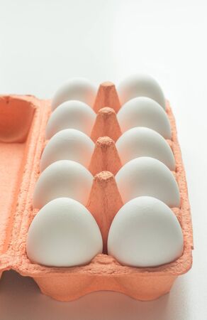 Organic white eggs in egg box. Close up.
