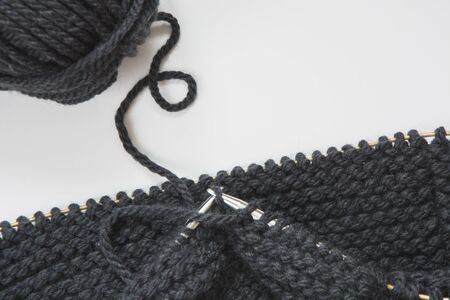 Close-up knitting scarf. Process of knitting. Top view. Copy space.の写真素材