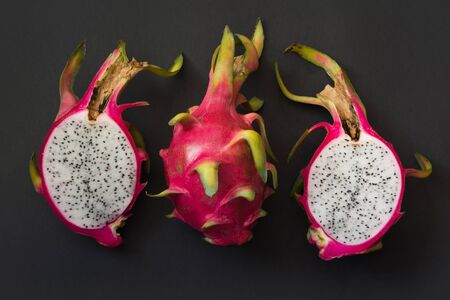 Isolated tropical pitaya, dragon fruit on blackbackground. Close up. top view.