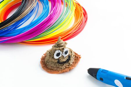 Colorful rainbow plastic filaments with for 3D pen laying on white background. New toy for child. 3d...