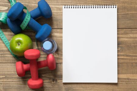 Sport and fitness equipment, creative flat lay on wooden board. Empty blank with space for you. Top view.の写真素材