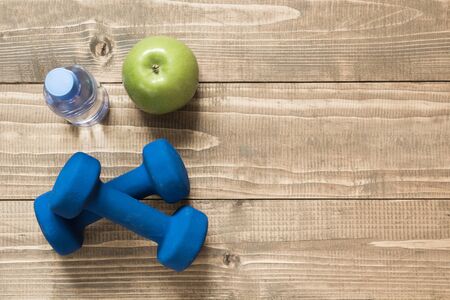 Sport and fitness equipment, creative flat lay on wooden board. Space for you. Flat lay.の写真素材