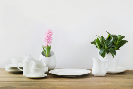 White tableware for serving. Crockery,dish, utensils and other different white stuff on white table-top. Kitchen still life. Copy space.の写真素材