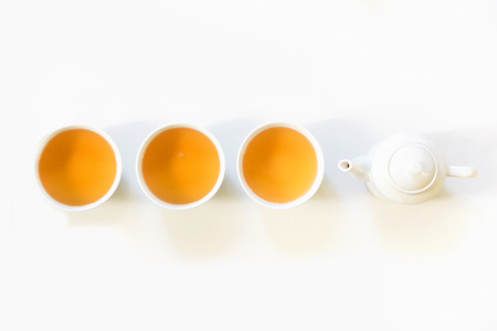 Green tea, cup of green tea on white. Top view and concept. Teatime. Copy space.の写真素材