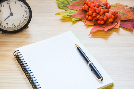 Autumn theme background with maple leaves, empty blank and pen for write. Copy space.の写真素材