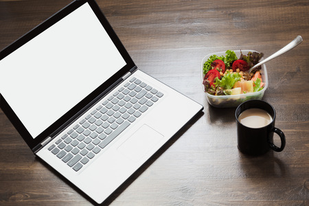 Workplace, healthy business lunch, salad on wooden table. Top view, copy space. Concept nutrition in office. To do list. Lunchbox.の写真素材