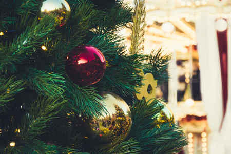 Details decorated Christmas tree with red balls, garland. Xmas card and pattern. Close up. Winter.の写真素材