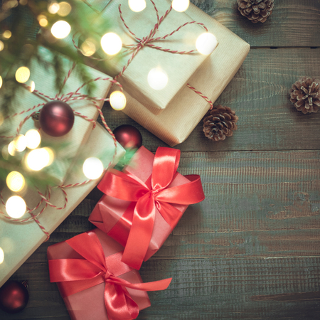New Year gifts in red decor under Cristmas tree. View from above. Boxing day.の写真素材