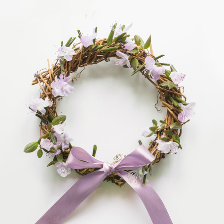 Spring wreath with flowers. Creative flat lay. View from above.の写真素材