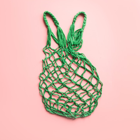 Empty shopping bag on pink. Zero waste concept. Space for text.View from above.の写真素材