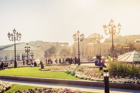 MOSCOW, RUSSIA - SEPTEMBER 23.09.2017: Tourists walk in Moscow on a background of buildings of Moscow Kremlin in sunny summer day. Center of the city.のeditorial素材