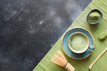 Ceremony traditional green matcha tea on black table. Top view. Space for text.の写真素材