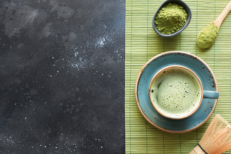 Ceremony traditional green matcha tea on black table. Top view. Space for text.の写真素材