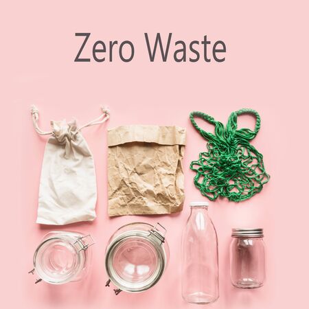 Set of jars and paper bag on pink background for zero waste storage and shopping. View from above. No Plastic.の写真素材