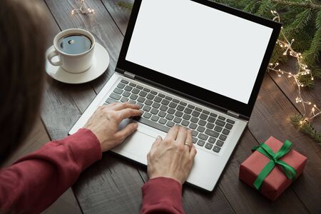 Woman searching or shopping by laptop. Xmas. Planing holidays. Home interior. Christmas sales.の写真素材