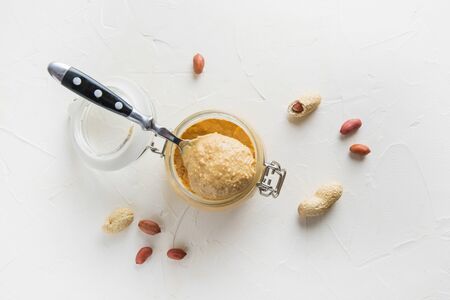 Peanut paste in glass gar. Healthy nutrition concept. View from above.の写真素材