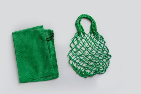 Empty shopping mesh bag on grey. Zero waste concept.の写真素材