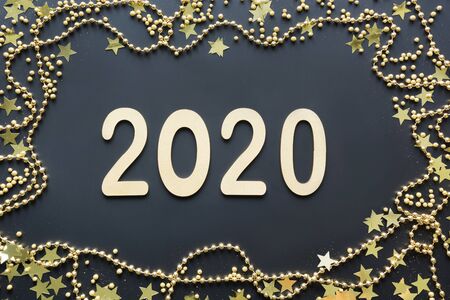Luxury golden date, border of gold decoration, shine stars and beads on black background. Happy New...