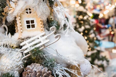 Details decorated Christmas tree with silver sled, garland. Xmas card and pattern. Close up. Winter.の写真素材