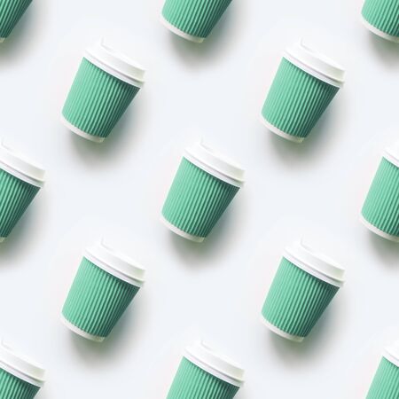 Many green cup of coffee takeaway paper cups as seamless pattern on white background. Flat lay style. Top view.の写真素材
