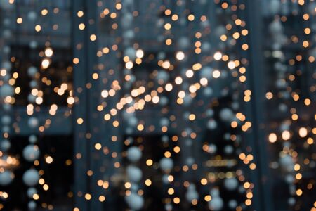 Big City Lights. Blurred garland. Night Light, bokeh, defocused background. Christmas holiday abstract.の写真素材