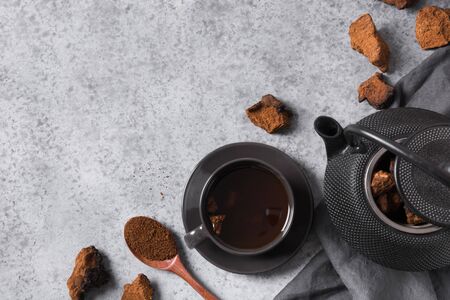 Preparation Chaga mushrooms coffee. Trendy healthy beverage. View from above. Flat lay. Space for text.の写真素材
