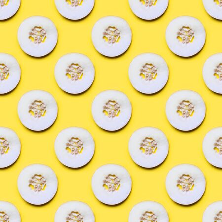 Seamless pattern of melon sliced on yellow background. Flat lay. Food.の写真素材