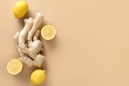 Fresh ginger root and lemon pattern on beige background. Top view. Space for text. Virus-protecting products.の写真素材