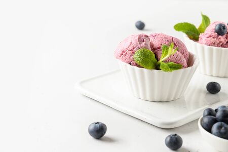 Berries ice cream, sorbet in bowls on white background. Space for text. Close up.の写真素材