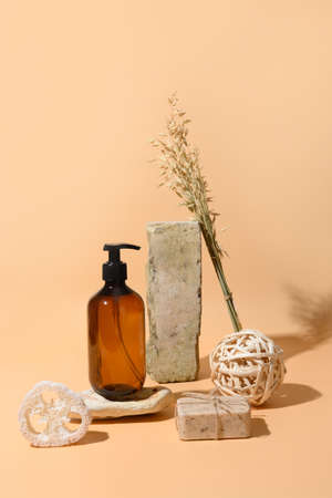 SPA accessories, soap, cosmetic care, oil monochrome vertical creative art composition on beige background. Natural skin care concept. Wellness.の写真素材