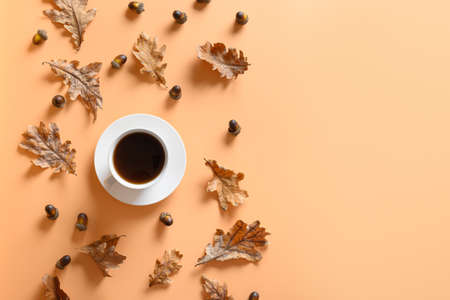 Acorn coffee on beige table. View from above. Space for text.