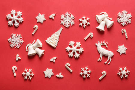 Christmas pattern of white holiday DIY decoration on red. Xmas abstract background. Xmas greeting...