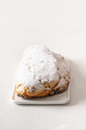 Christmas stollen - traditional German bread on white background. Close up. Vertical format.の写真素材