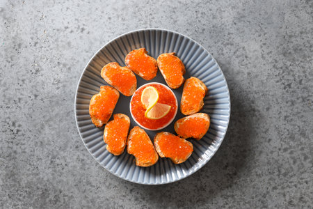 Canape with red caviar for New Year or Christmas party. View from above.の写真素材