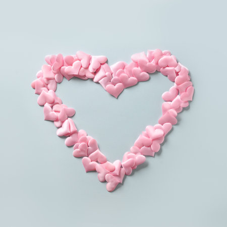 Pink hearts in shape in big heart on blue background. Valentines day square greeting card with copy...