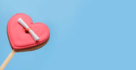 Valentines Day banner with glazed cookies in shape of heart with Love letter on blue background....