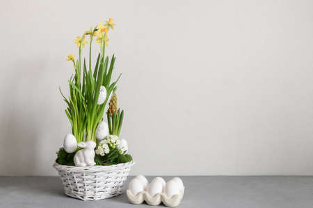 Easter handmade flower composition with blossom narcissus.