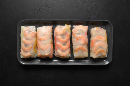 Vietnam spring rolls with prawn on black.の写真素材