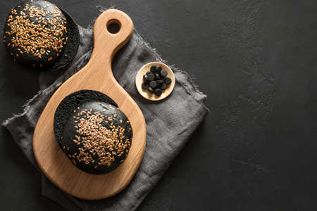 Whole grain gluten-free charcoal bread or buns.の写真素材