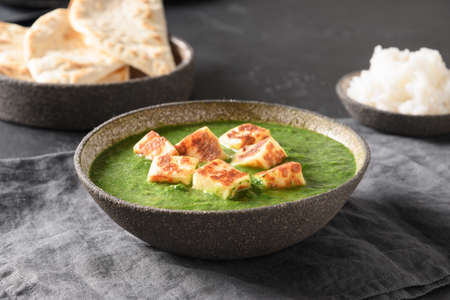 Palak Paneer served basmati rice on grey background.の写真素材