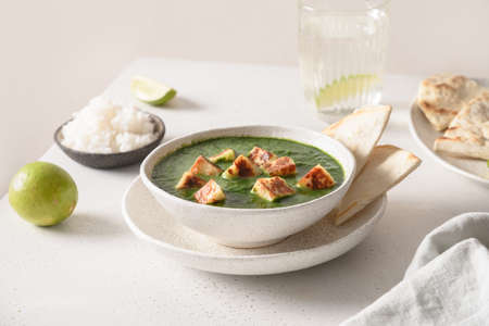 Palak Paneer served basmati rice on white table.の写真素材