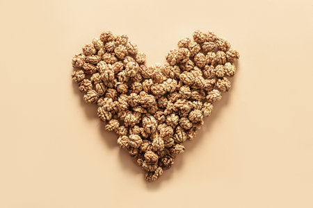 Fresh walnuts without shells in shape of heart. Walnuts concept as healthy food for heart.の写真素材
