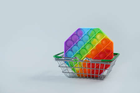 New popular silicone colorful antistress pop it toy in shopping basket.の写真素材