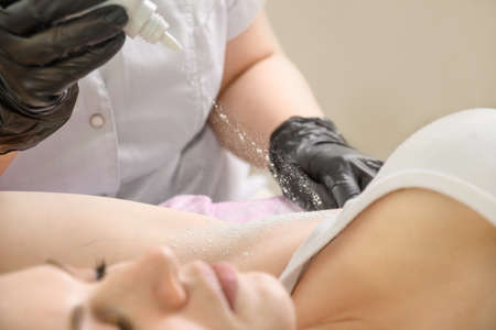 Armpit processing and disinfection with talcum powder after electrolysisの写真素材