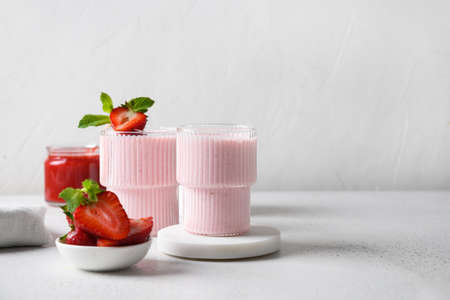 Indian strawberry lassi or milkshake on white backgroundの写真素材