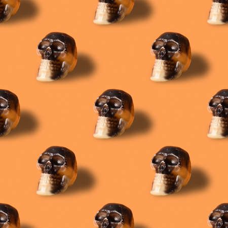 Halloween seamless pattern of skull on orange background.の写真素材