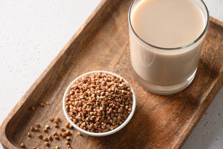 Healthy buckwheat milk in glass with grain ingredient.の写真素材